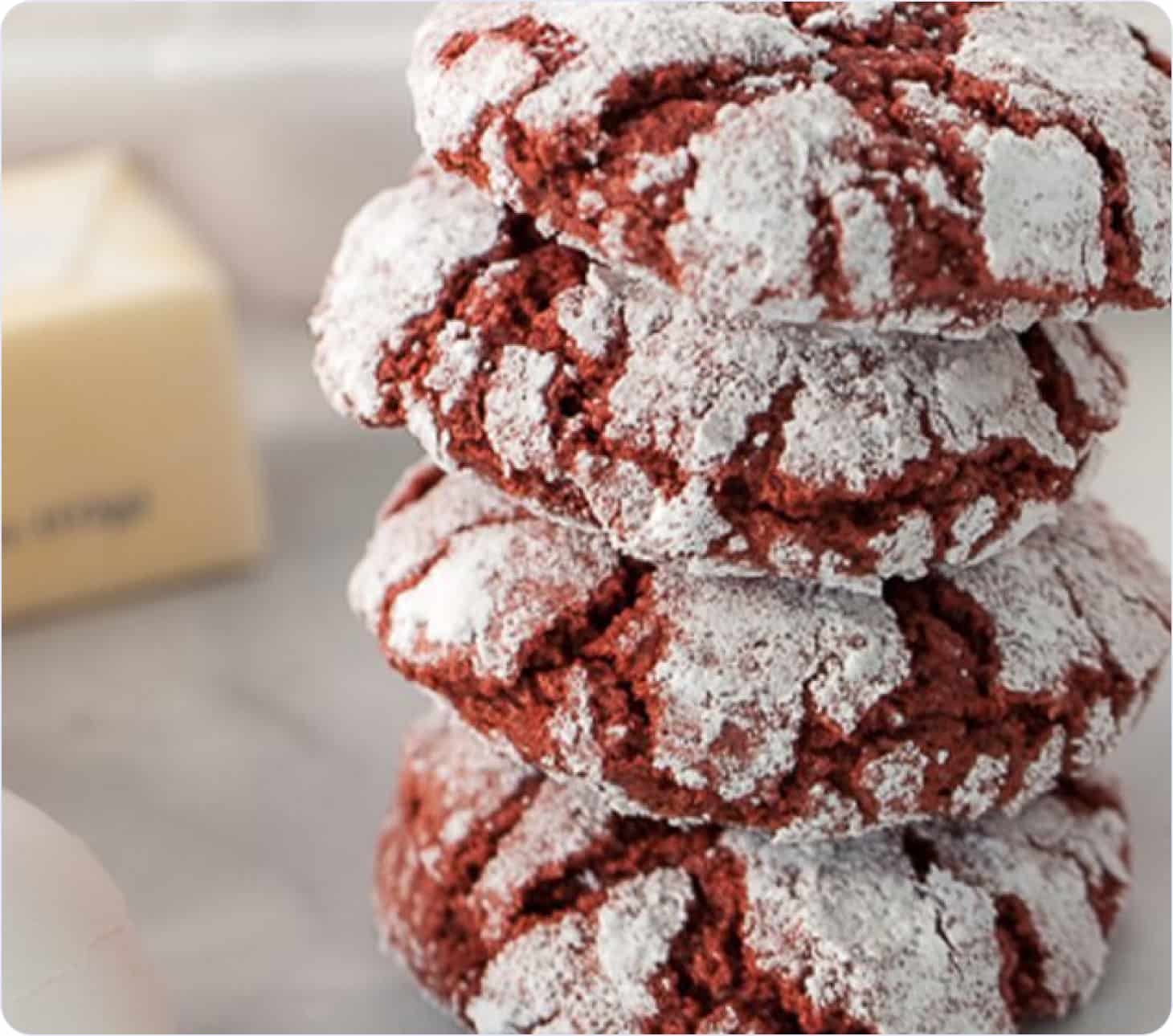 Red Christmas cookies sprinkled with powdered sugar