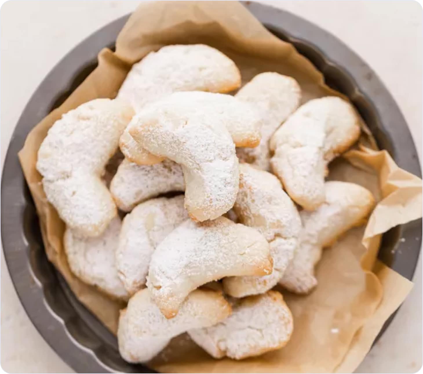 Crescent cookies sprinkled with powdered sugar